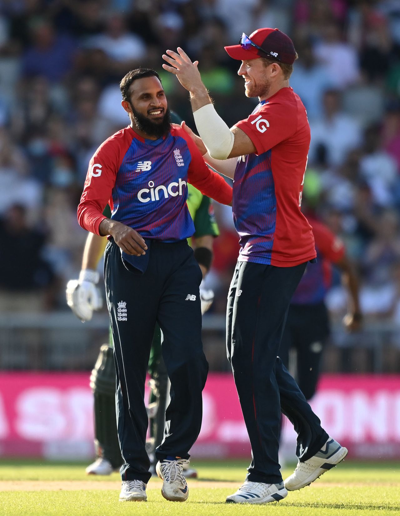 Adil Rashid of England celebrates a wicket with David Willey, England vs Pakistan, 3rd T20I, Old Trafford, July 20, 2021