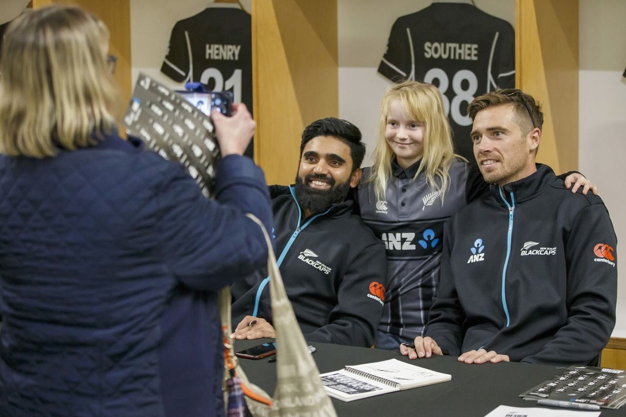 Ajaz Patel and Tim Southee pose with a fan during the mace tour, Eden Park, July 27, 2021