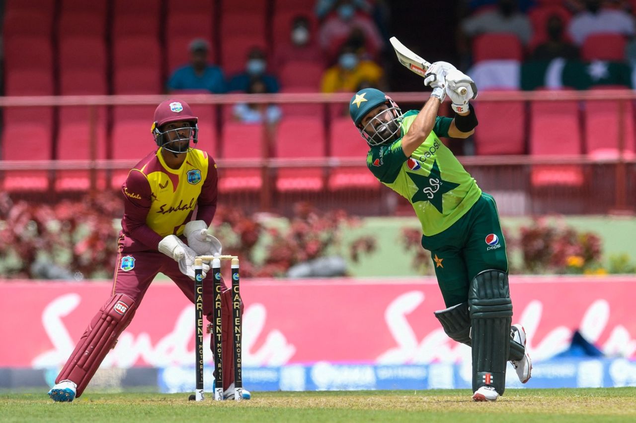 Mohammad Rizwan hits a six as Nicholas Pooran looks on, West Indies vs Pakistan, 2nd T20I, Guyana, July 31, 2021