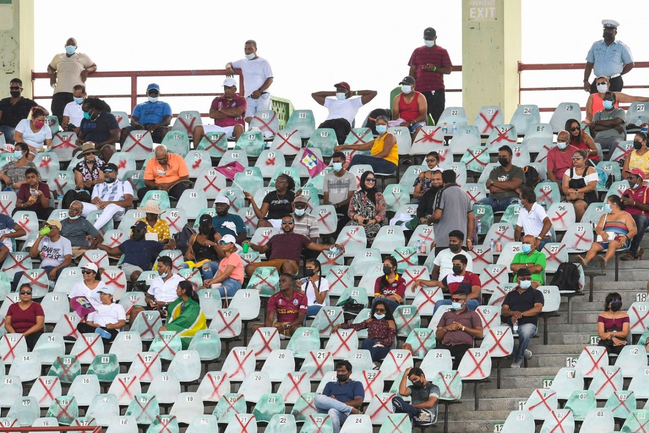 Spectators occupying a socially-distanced seating arrangement follow the match at the Providence Stadium, West Indies vs Pakistan, 2nd T20I, Guyana, July 31, 2021