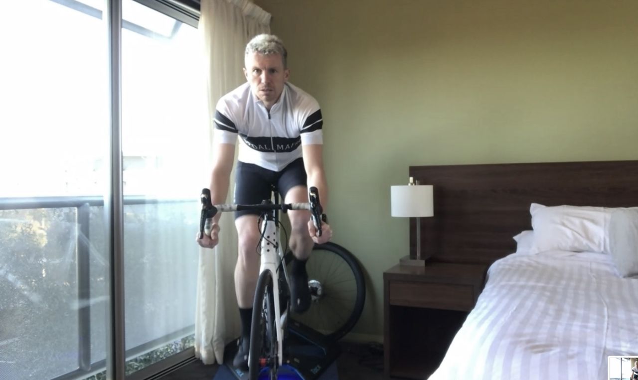 Peter Siddle exercises on a stationary bike in his hotel room during a quarantine after travelling from Melbourne ahead of joining the Tasmania state squad, Hobart, July 29, 2020