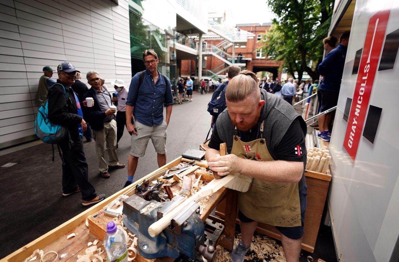 Fancy a freshly crafted bat, anyone? A Gray Nicolls bat-maker at work outside Lord's, England vs India, 2nd Test, Lord's, 1st day, August 12, 2021