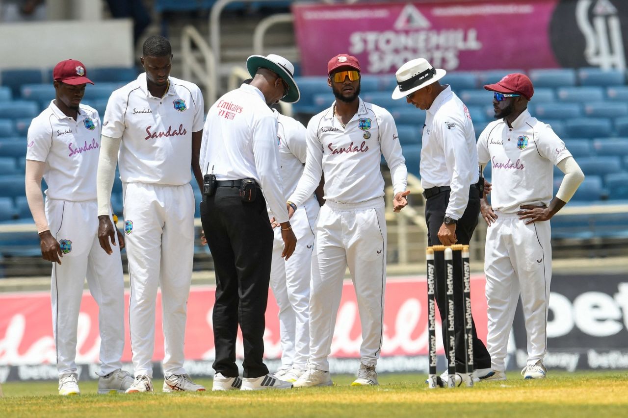Kraigg Brathwaite gestures to the umpires about the damp spot that's affecting Jason Holder's run-up, West Indies vs Pakistan, 2nd Test, Jamaica, 3rd day, August 22, 2021