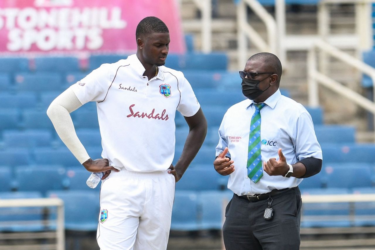 Jason Holder talks to match referree Richie Richardson about the wet spot on his run up, West Indies vs Pakistan, 2nd Test, Jamaica, 3rd day, August 22, 2021
