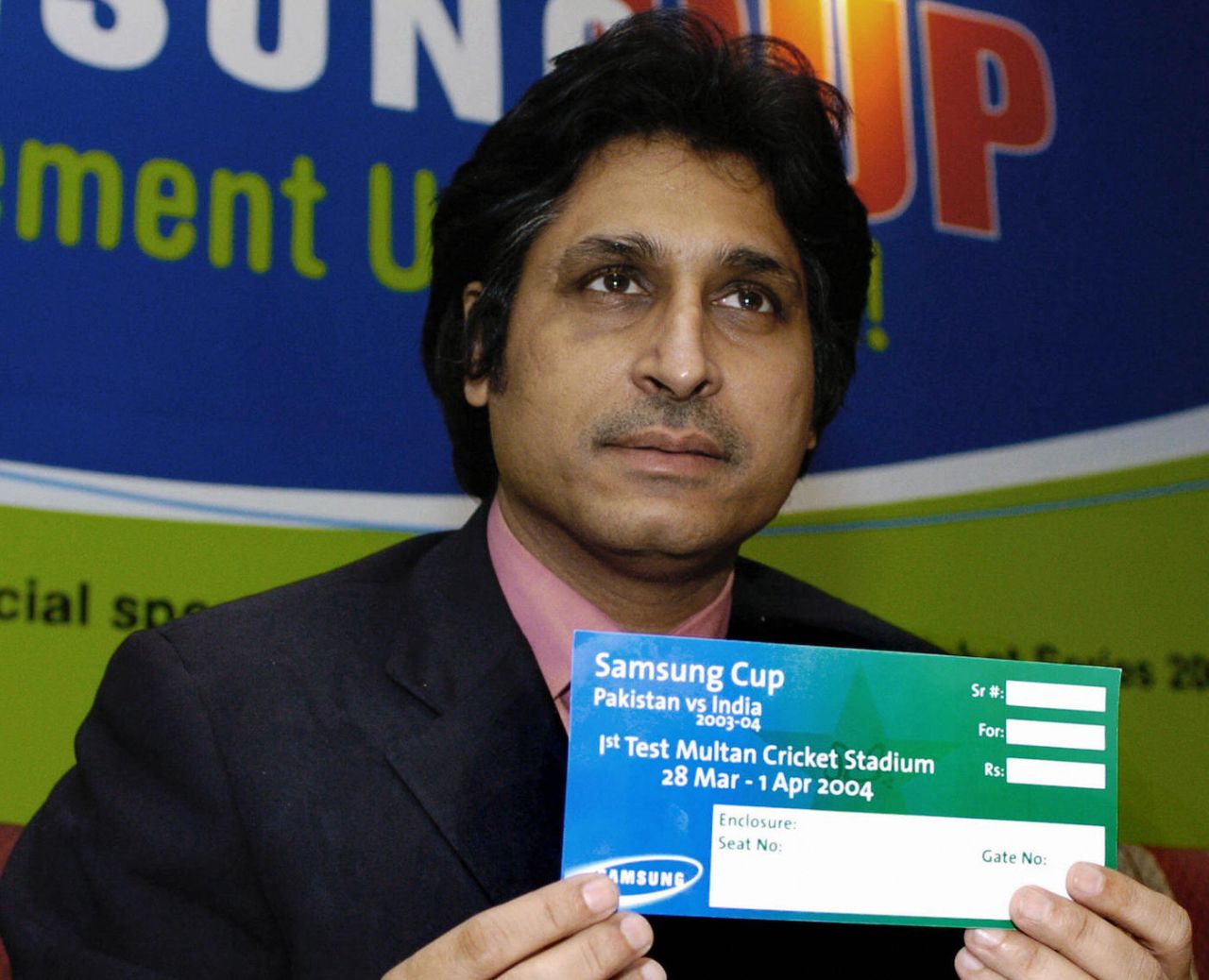 PCB CEO Ramiz Raja shows a specimen of a ticket for the Pakistan vs India series, Karachi, February 27, 2004