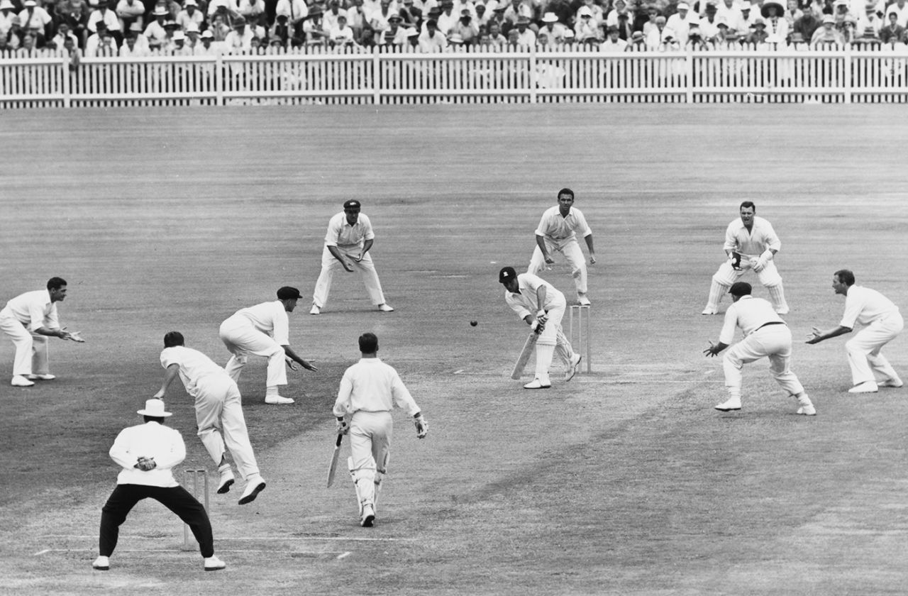 Ted Dexter is surrounded by Australian fielders while playing a shot off Graham McKenzie, Australia vs England, 3rd Test, Sydney, 3rd day, January 14, 1963