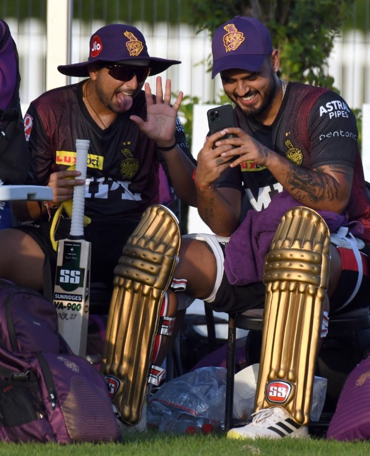 Kuldeep Yadav and Nitish Rana take a break, Abu Dhabi, September 3, 2021