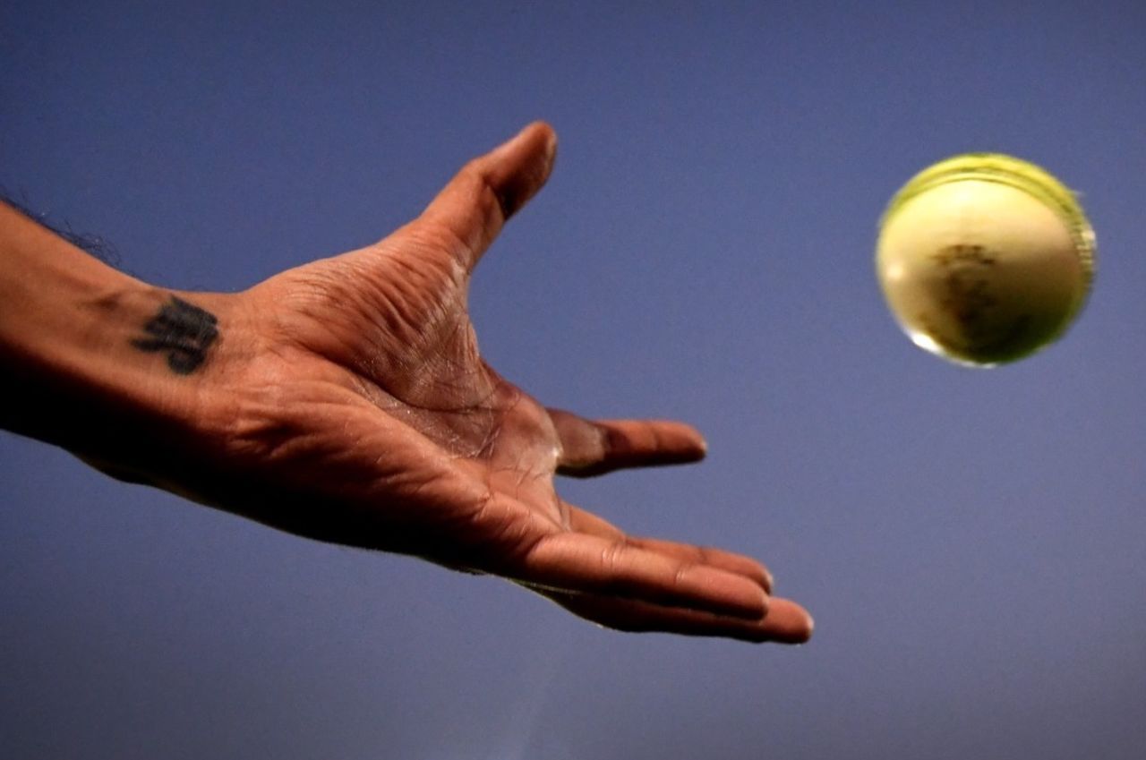 Generic shot of fielder catching a white ball