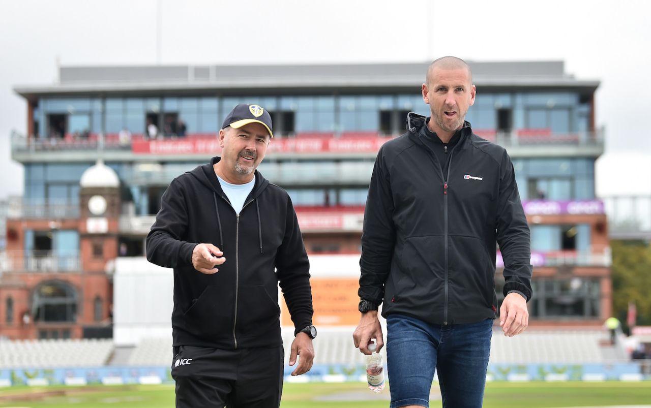 Umpires Richard Illingworth and Michael Gough take a stroll around the park, England vs India, 5th Test, Manchester, 1st day, September 10, 2021