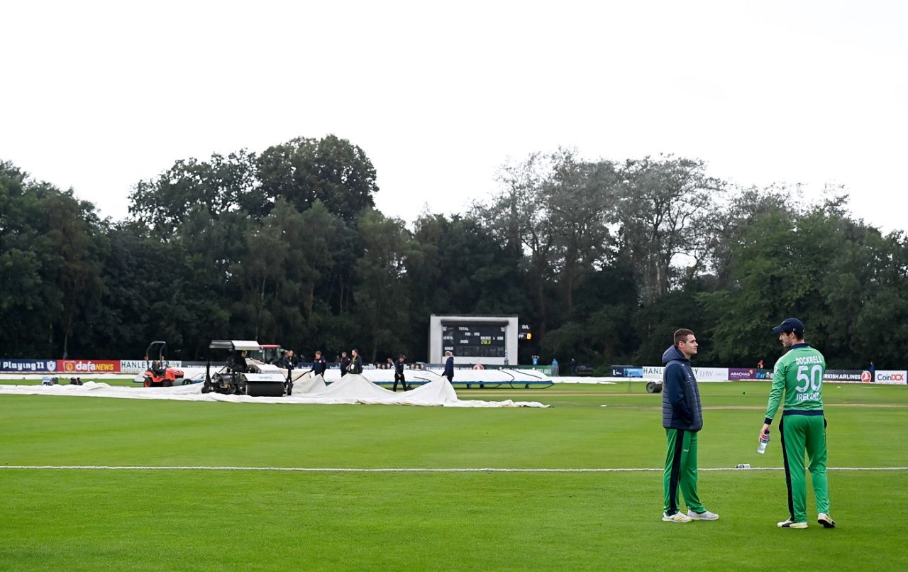 Josh Little and George Dockrell have a chat while the ground staff works during a rain break, Ireland vs Zimbabwe, 2nd ODI, Belfast, September 10, 2021