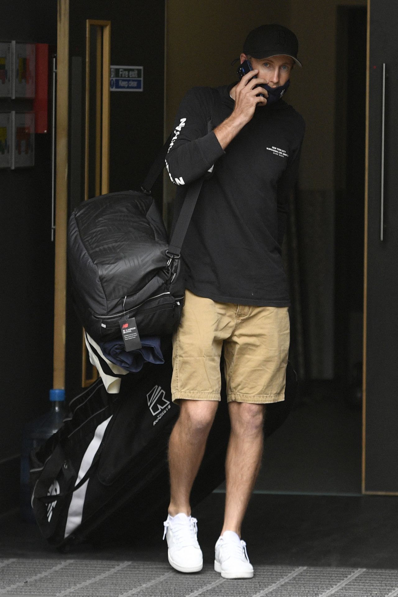 Joe Root talks on the phone as he leaves Old Trafford, England vs India, 5th Test, Manchester, 1st day, September 10, 2021