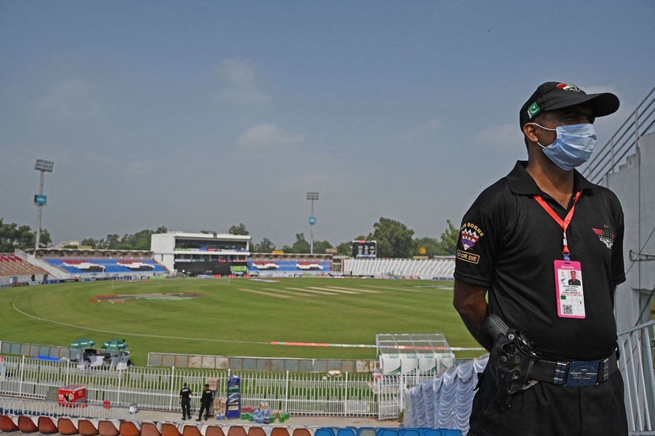 A securityperson stands guard at the Rawalpindi Cricket Stadium, Rawalpindi, September 17, 2021