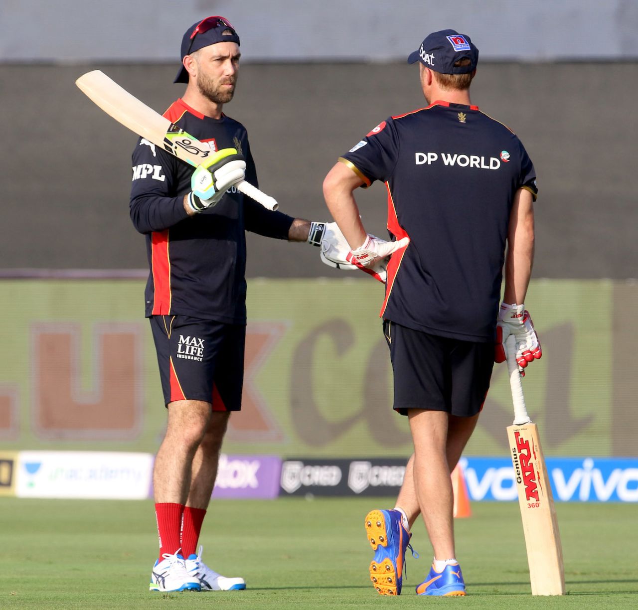Glenn Maxwell and AB de Villiers have a chat before the game, Kolkata Knight Riders vs Royal Challengers Bangalore, IPL 2021, Abu Dhabi, September 20, 2021