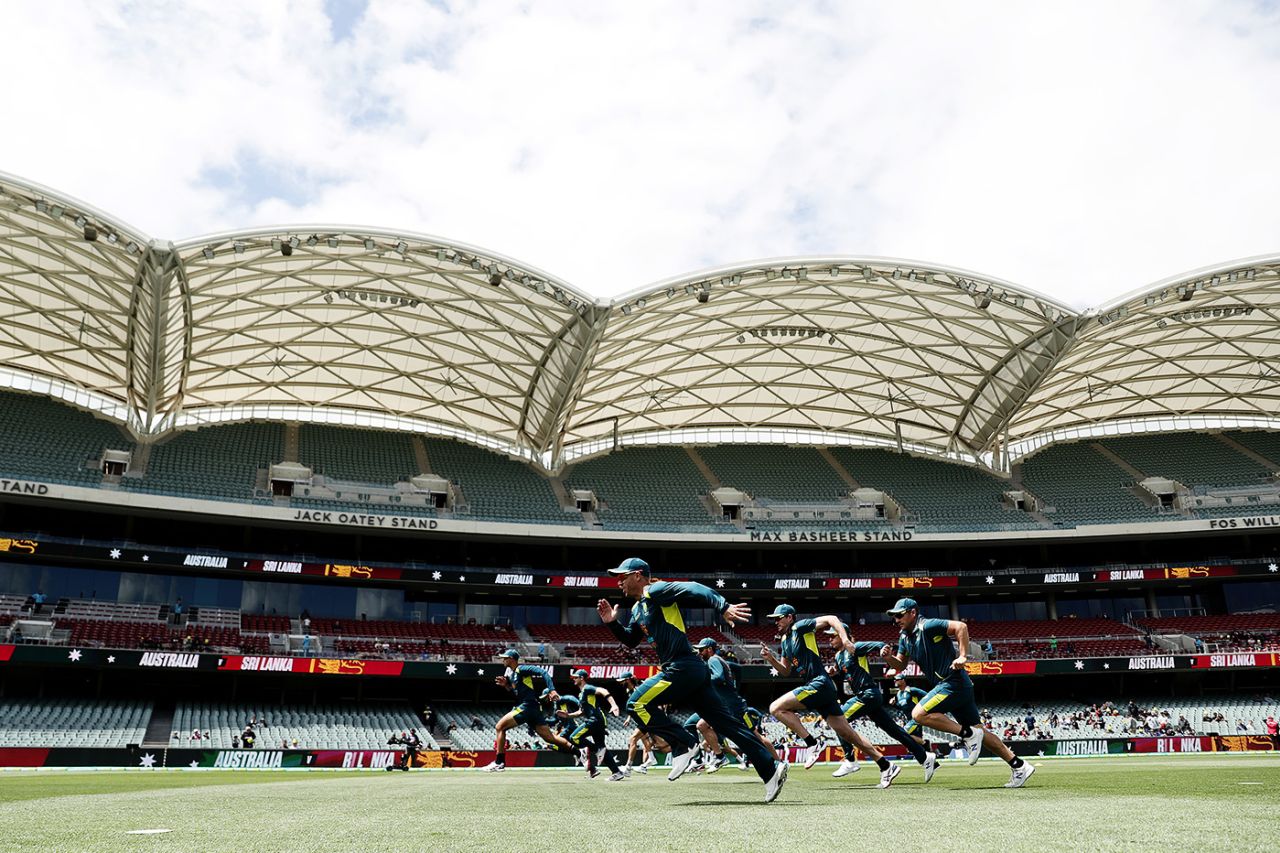 Australia players run across the ground to warm up, Adelaide, October 27, 2019
