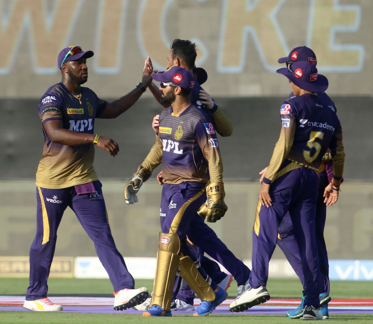 The Kolkata Knight Riders players celebrate a wicket, Chennai Super Kings vs Kolkata Knight Riders, IPL 2021, Abu Dhabi, September 26, 2021