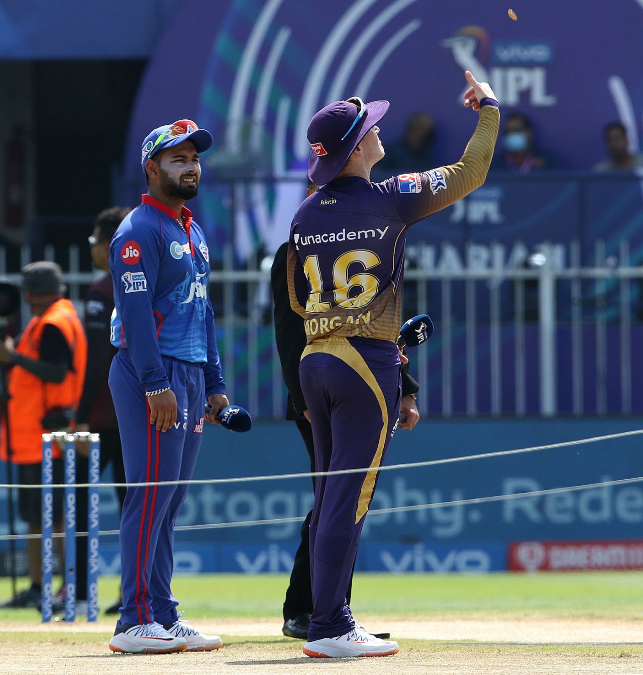 Rishabh Pant looks on as Eoin Morgan flips the coin, Kolkata Knight Riders vs Delhi Capitals, IPL 2021, Sharjah, September 28, 2021