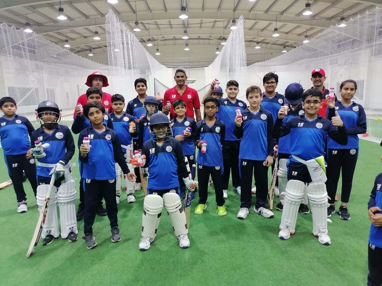 Kids practice at the indoor cricket centre, Oman