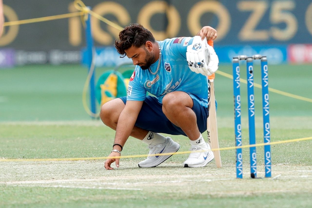 Rishabh Pant has a look at the Dubai pitch ahead of Delhi Capitals' game against Chennai Super Kings, Delhi Capitals vs Chennai Super Kings, IPL 2021, Dubai, October 4, 2021