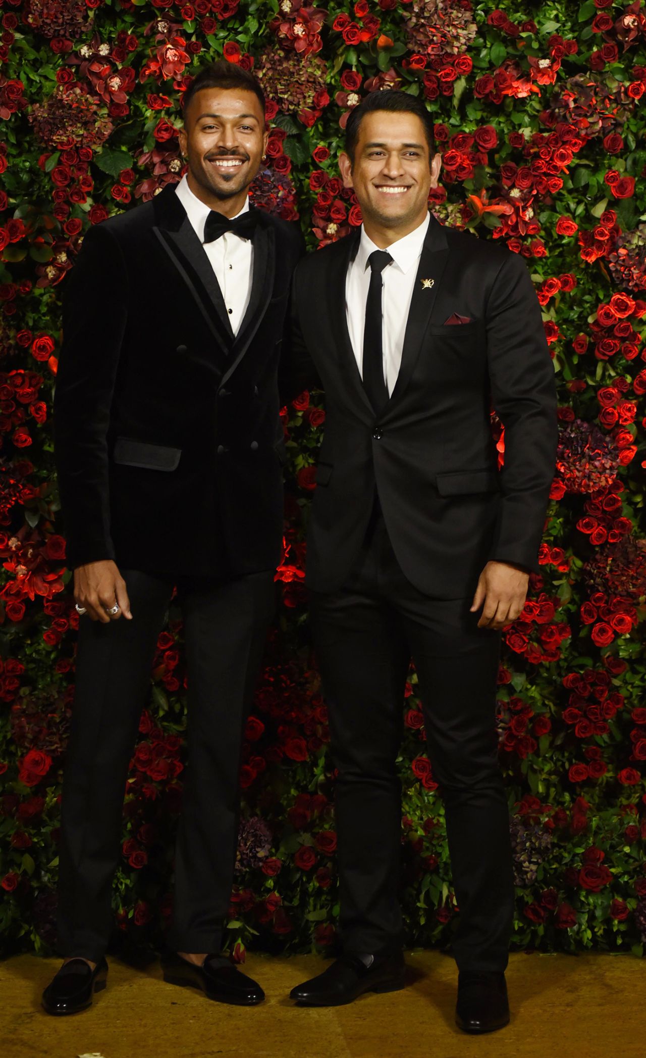 Hardik Pandya and MS Dhoni pose for photos while attending the wedding reception of Bollywood actors Deepika Padukone and Ranveer Singh in Mumbai, December 1, 2018