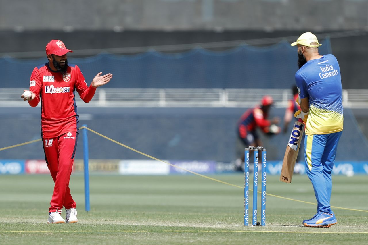 Adil Rashid and Moeen Ali, old friends but on opposite sides here, catch up before the game, Chennai Super Kings vs Punjab Kings, IPL 2021, Dubai, October 7, 2021