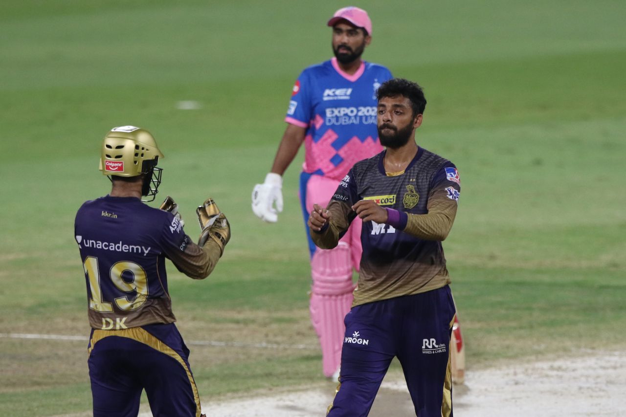 Varun Chakravarthy celebrates the wicket of Chris Morris with Dinesh Karthik, Kolkata Knight Riders vs Rajasthan Royals, IPL 2021, Sharjah, October 7, 2021