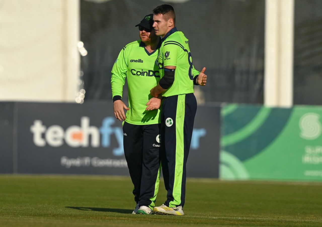 Josh Little gets a pat of approval from Paul Stirling after picking up the wicket of Wellington Masakadza, third T20I, Ireland vs Zimbabwe, Bready Cricket Club, Magheramason, September 1, 2021