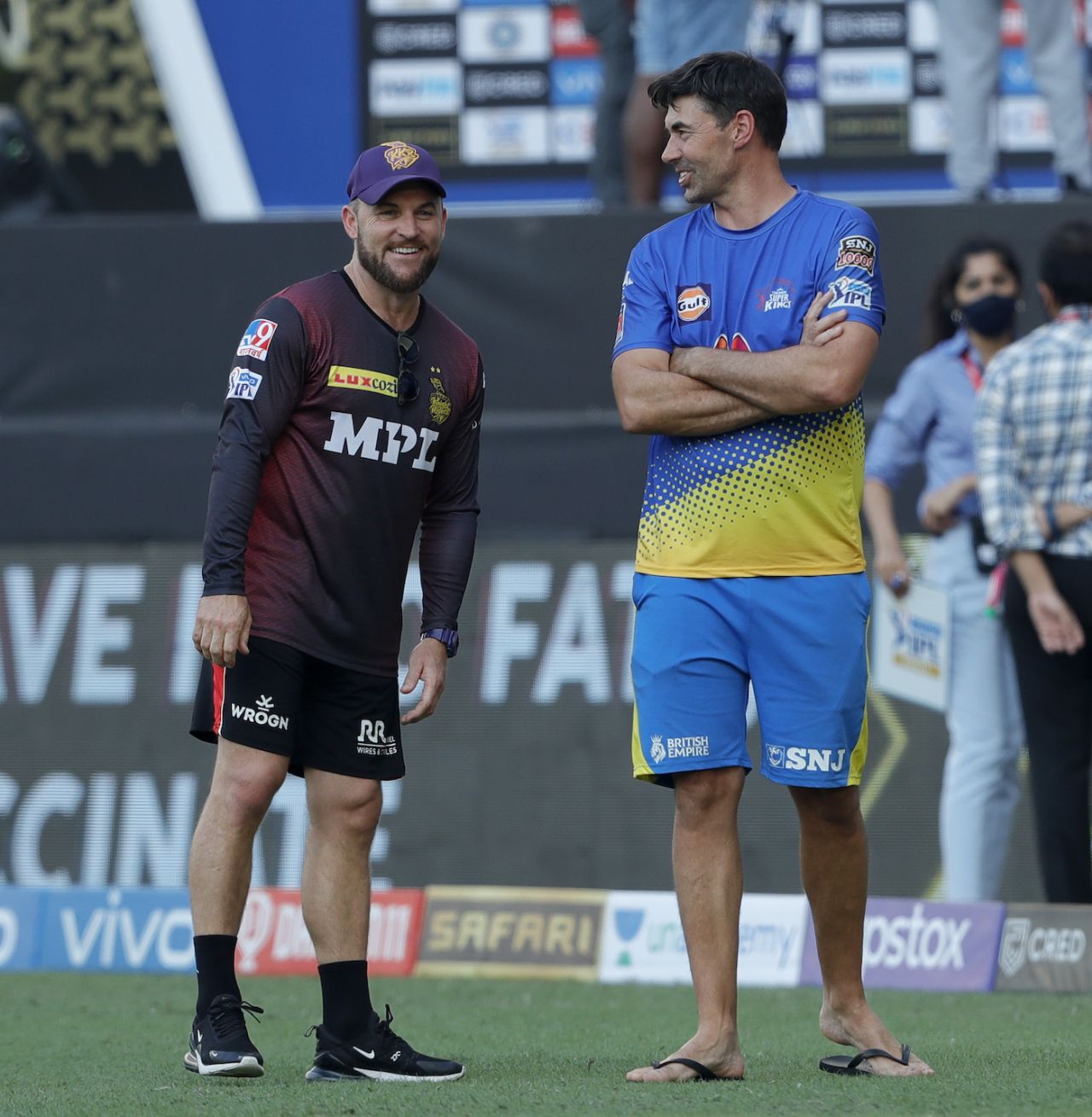Brendon McCullum and Stephen Fleming, the two coaches, catch up before the match, Chennai Super Kings vs Kolkata Knight Riders, IPL 2021 final, Dubai, October 15, 2021