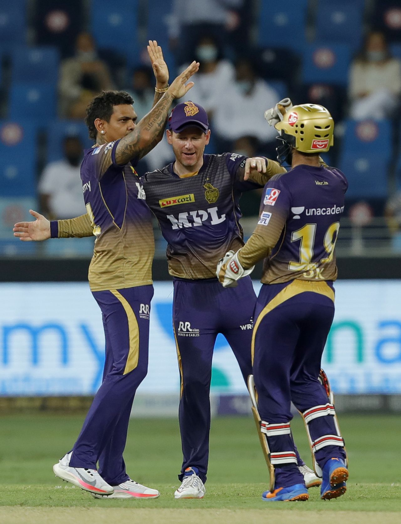 Sunil Narine celebrates Ruturaj Gaikwad's wicket with Eoin Morgan and Dinesh Karthik, Chennai Super Kings vs Kolkata Knight Riders, IPL 2021 final, Dubai, October 15, 2021