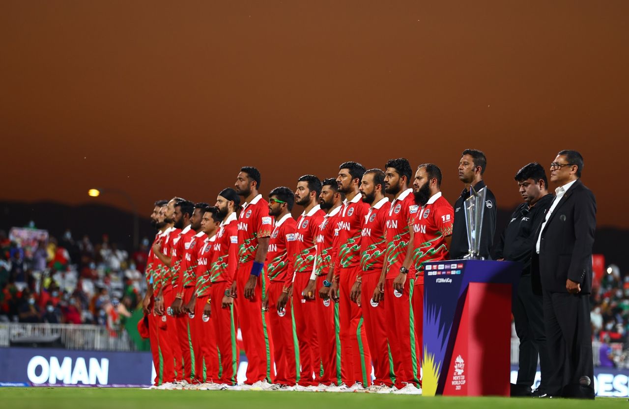 Oman's players line up for their national anthem as the setting sun provides a stunning backdrop, Oman vs Bangladesh, T20 World Cup, Al Amerat, October 19, 2021