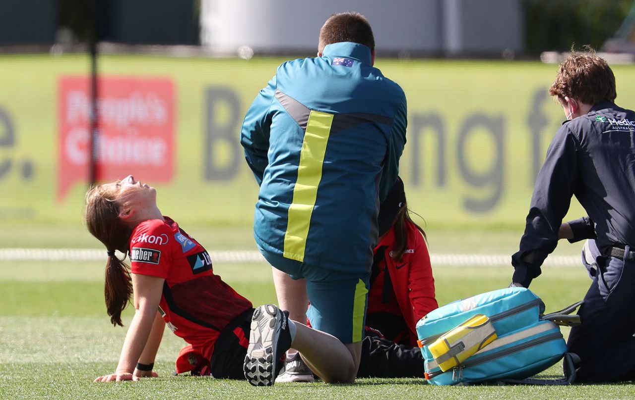 Georgia Wareham is helped by medics after hurting herself in the outfield, Melbourne Renegades vs Adelaide Strikers, WBBL, Hobart, October 20, 2021