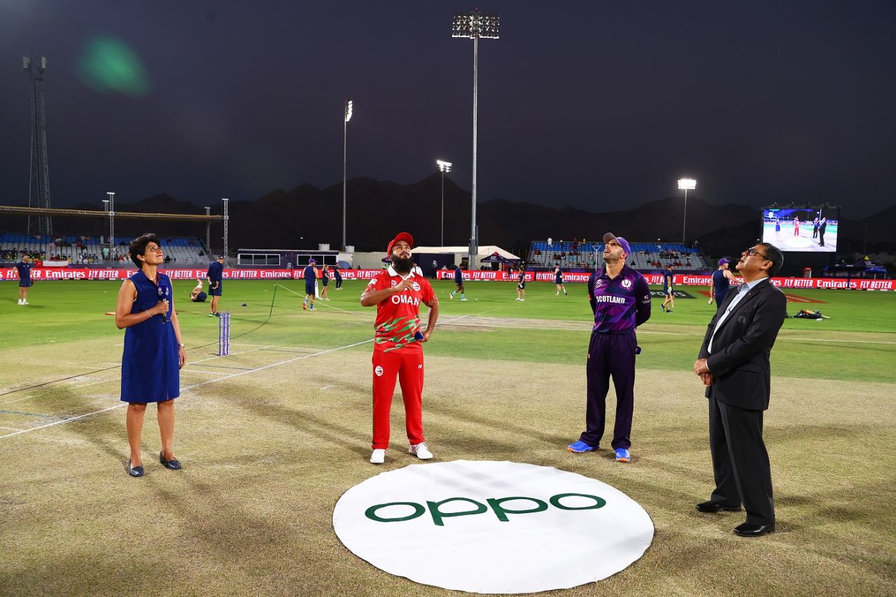 Zeeshan Maqsood and Kyle Coetzer wait for the coin to land at the toss, Oman vs Scotland, T20 World Cup, Muscat, October 21, 2021