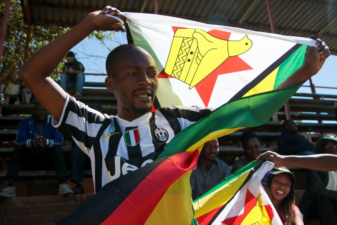 A Zimbabwe supporter sings the national anthem, Bulawayo, August 6, 2016
