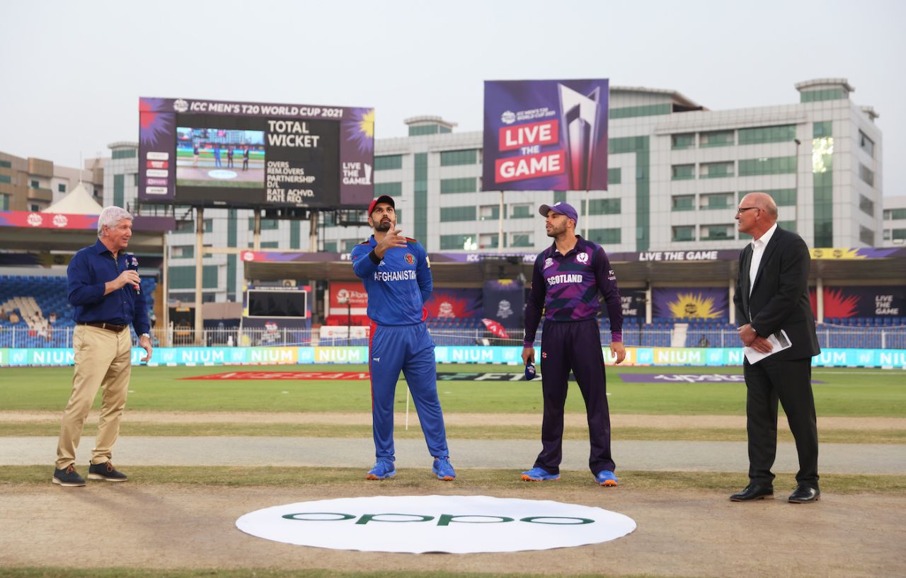 Alan Wilkins, Kyle Coetzer and Jeff Crowe watch as Mohammad Nabi flips the coin, Afghanistan vs Scotland, T20 World Cup 2021, Group 2, Sharjah, October 25, 2021