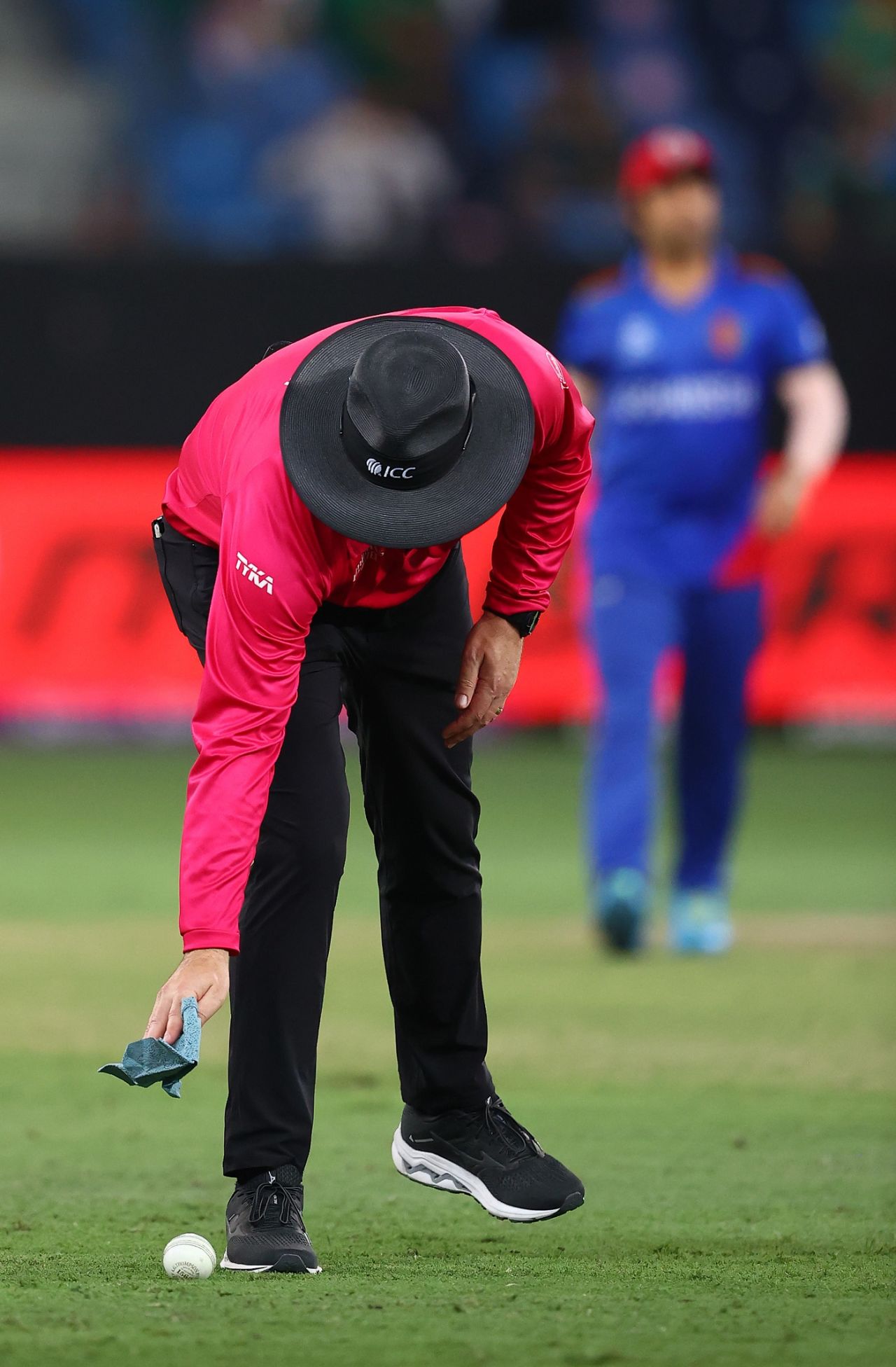 Times of Covid: The umpire bends to sanitise the ball, Afghanistan vs Pakistan, T20 World Cup, Group 2, Dubai, October 29, 2021