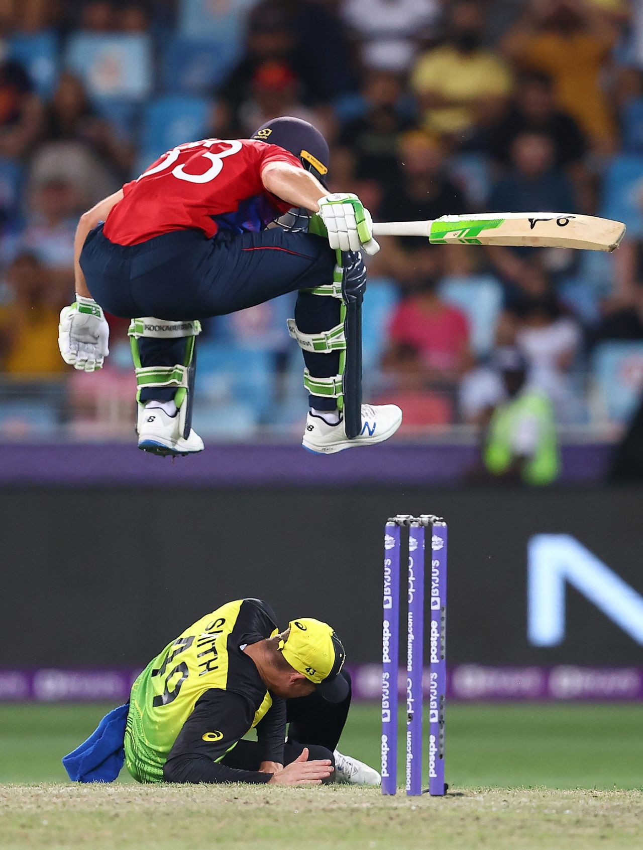 Jos Buttler jumps to avoid a collision with Steven Smith, Australia vs England, T20 World Cup, Group 1, Dubai, October 30, 2021