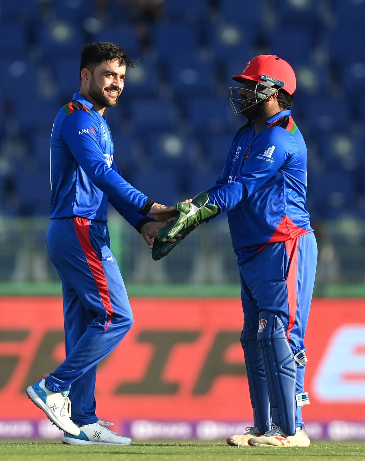 Rashid Khan and Mohammad Shahzad celebrate a wicket, Afghanistan vs Namibia, T20 World Cup, Group 2, Abu Dhabi, October 31, 2021