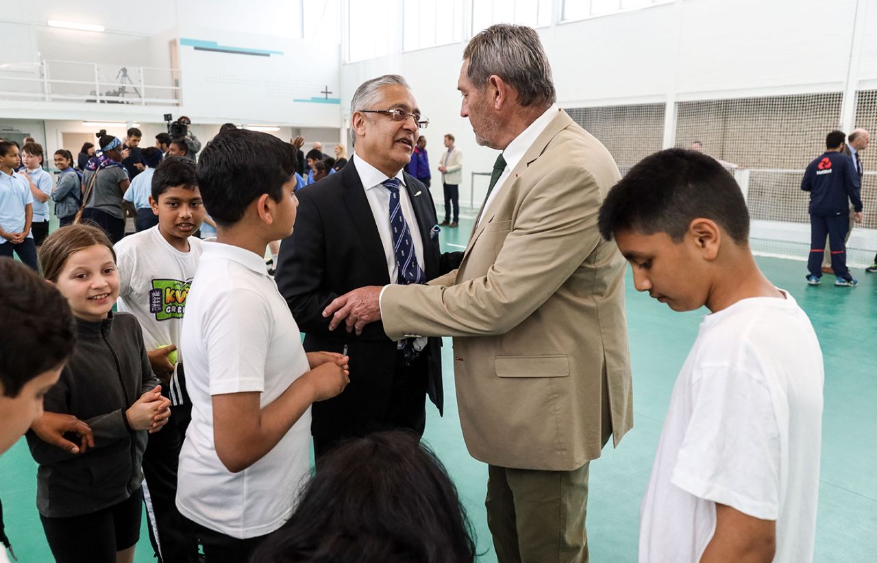 Lord Patel of Bradford speaks with Graham Gooch at an event at Leyton Cricket Club, Leyton, June 26, 2019