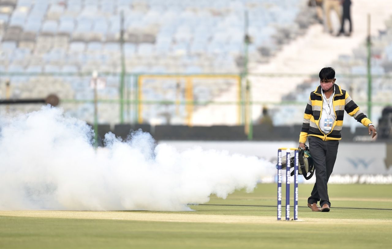 Groundstaff in Jaipur fumigate the pitch before the first India v New Zealand T20I, Jaipur, November 17, 2021
