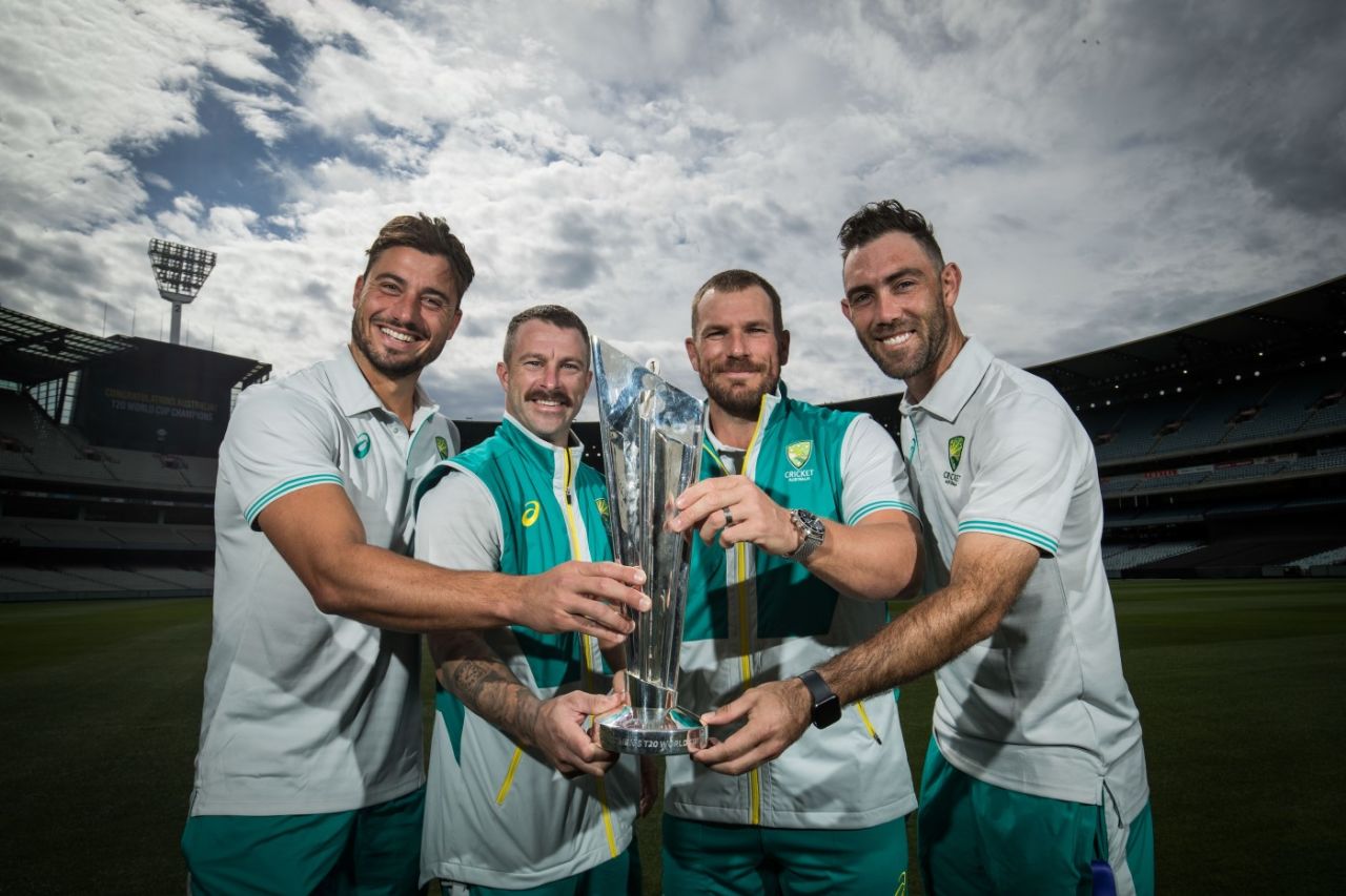 Marcus Stoinis, Matthew Wade, Aaron Finch and Glenn Maxwell pose with the T20 World Cup trophy at the MCG