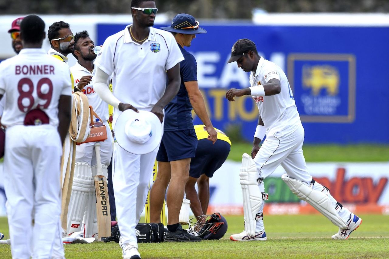 Angelo Mathews stretches the sore area after picking up a thigh strain, Sri Lanka vs West Indies, 2nd Test, Galle, 2nd day, November 30, 2021