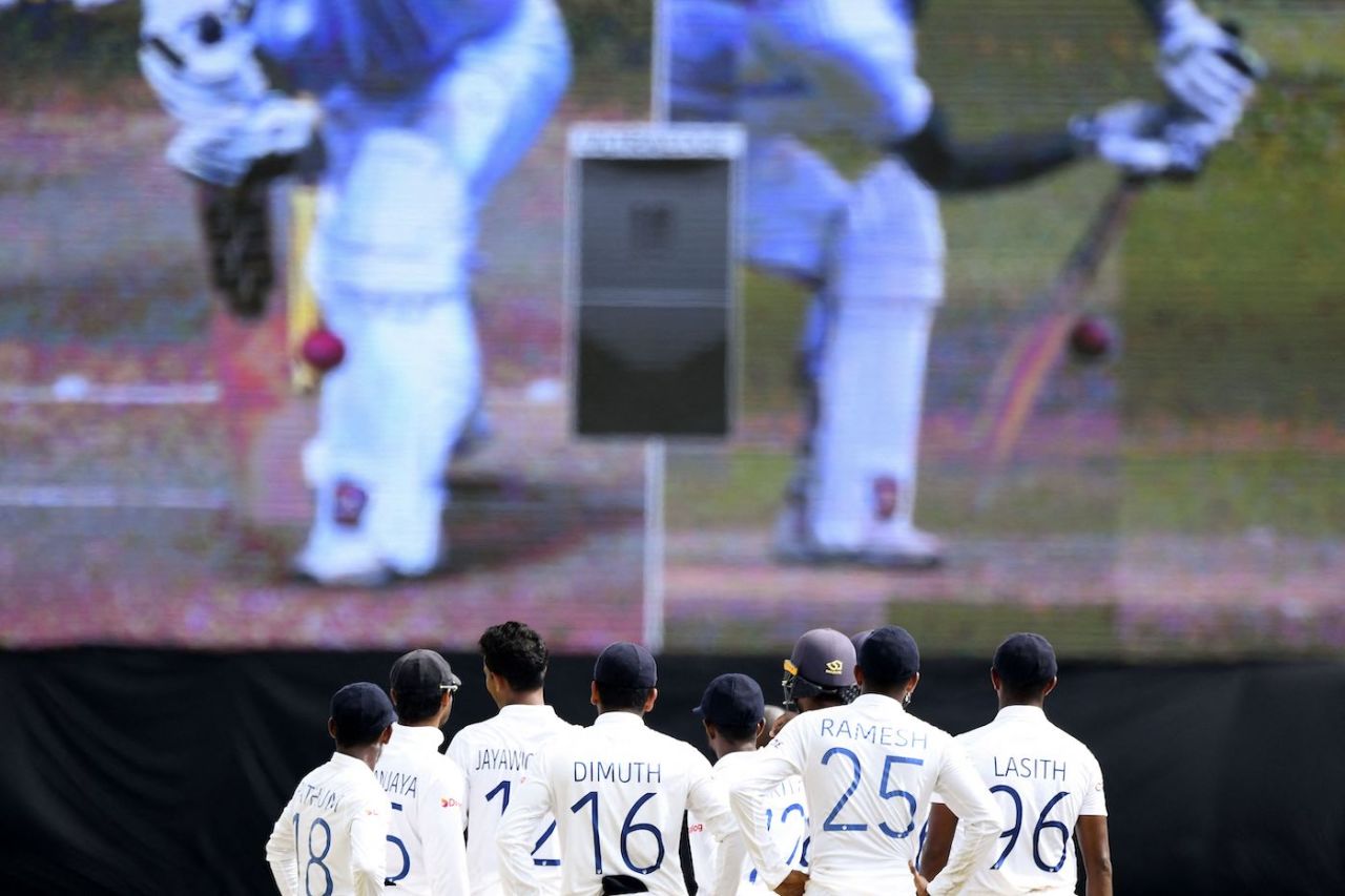 The Sri Lankan players keep a close eye on the giant screen as a replay plays out, Sri Lanka vs West Indies, 2nd Test, Galle, 2nd day, November 30, 2021