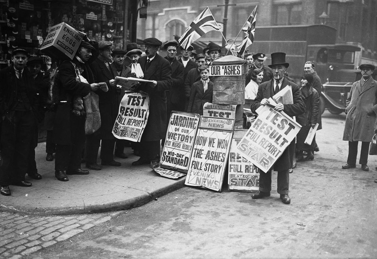 A newspaper seller in Farringdon Street, London uses his stand to celebrate England's 1932-33 Ashes victory, Australia vs England, Bodyline