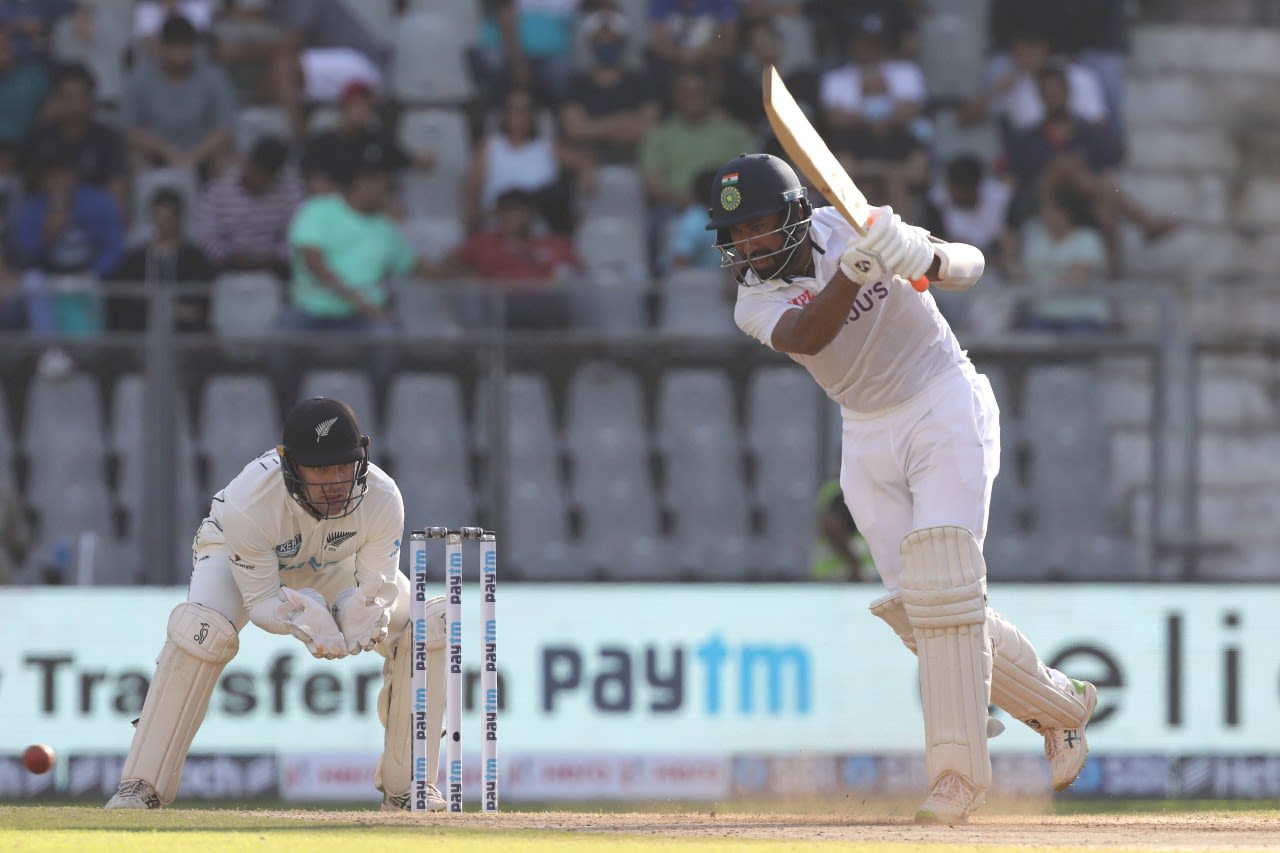 Cheteshwar Pujara steps out to drive with the spin, India v New Zealand, 2nd Test, Mumbai, 2nd day, December 4, 2021