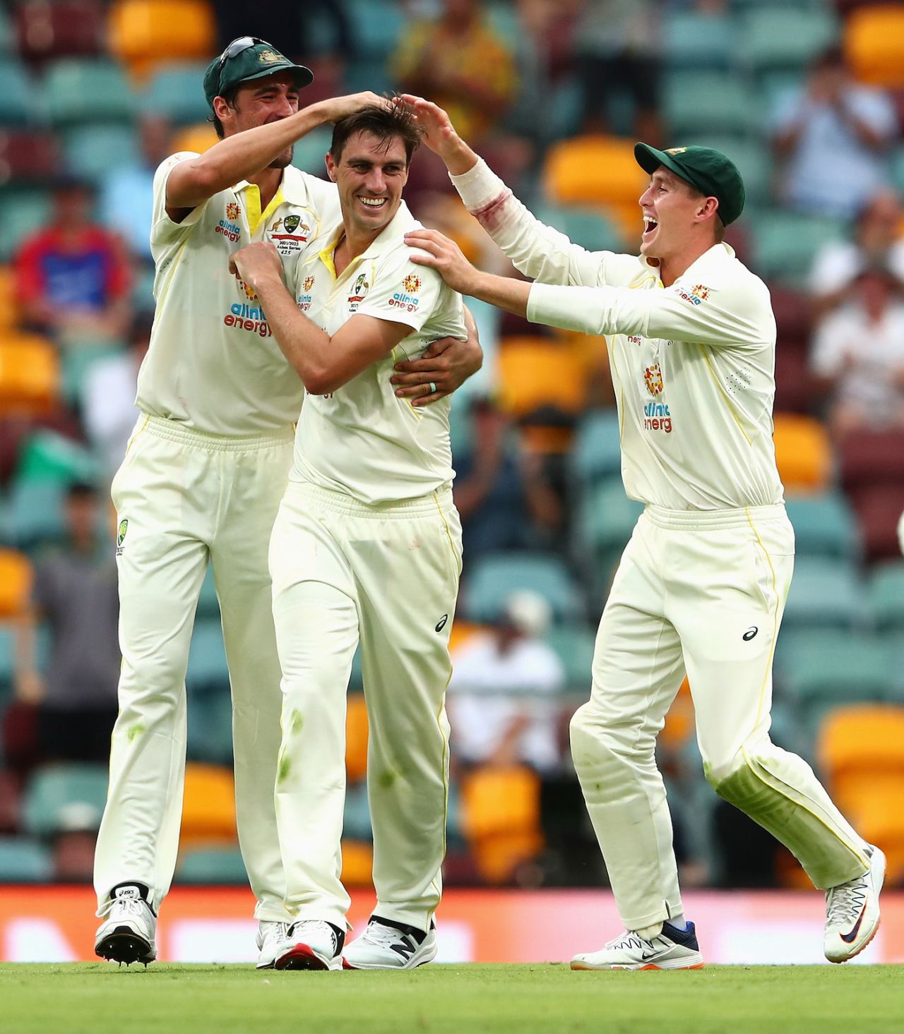 Mitchell Starc and Marnus Labuschagne congratulate Pat Cummins after he picked up Chris Woakes' wicket, Australia vs England, 1st Ashes Test, Brisbane, 1st day, December 8, 2021