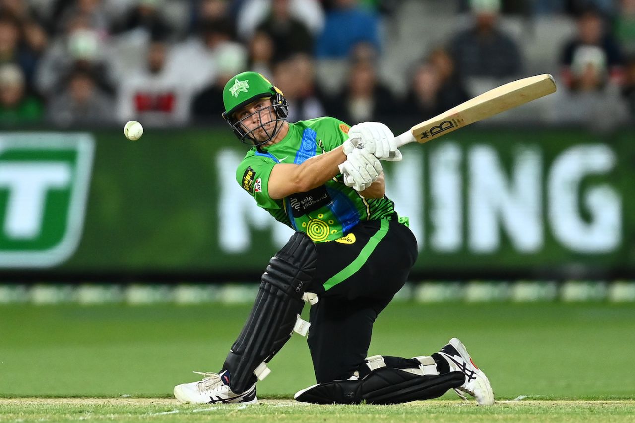 Hilton Cartwright of Melbourne Stars plays a slog sweep, Melbourne Stars vs Sydney Thunder, BBL 2021-22, Melbourne, December 10, 2021