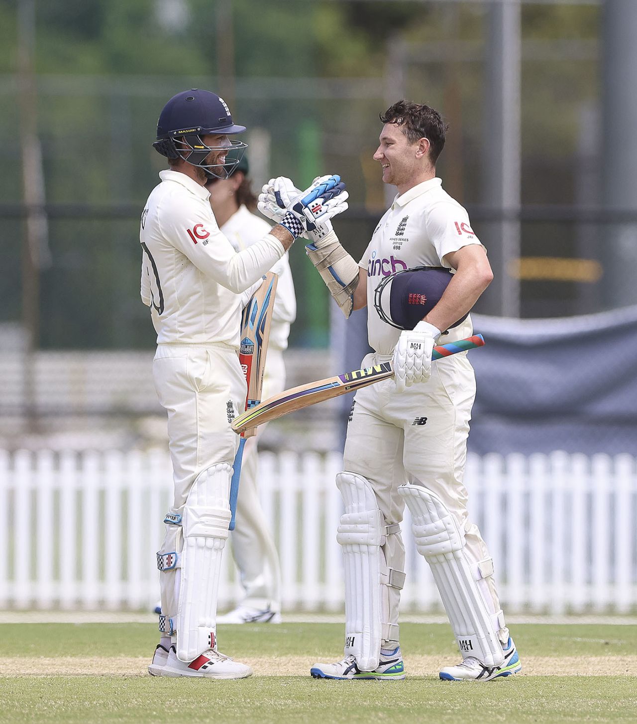 James Bracey celebrates his hundred with Ben Foakes, Australia A vs England Lions, Ian Healy Oval, Brisbane, December 12, 2021
