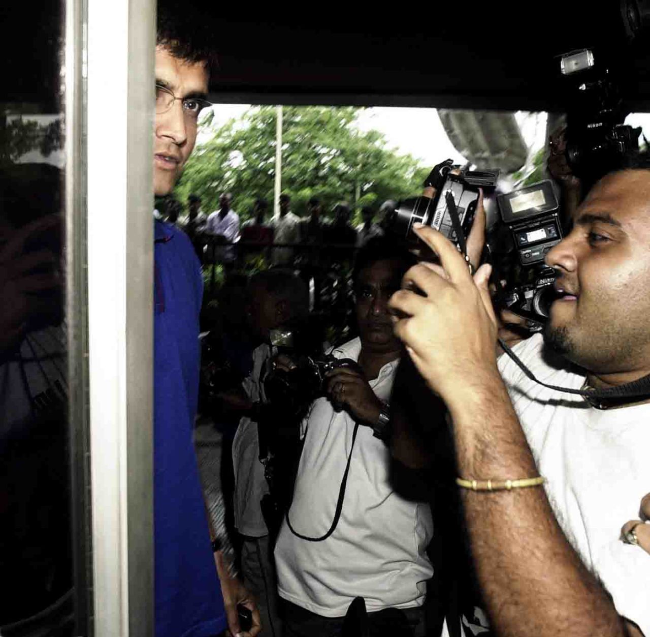 Sourav Ganguly is mobbed press photographers at Eden Gardens, Kolkata, August 5, 2004