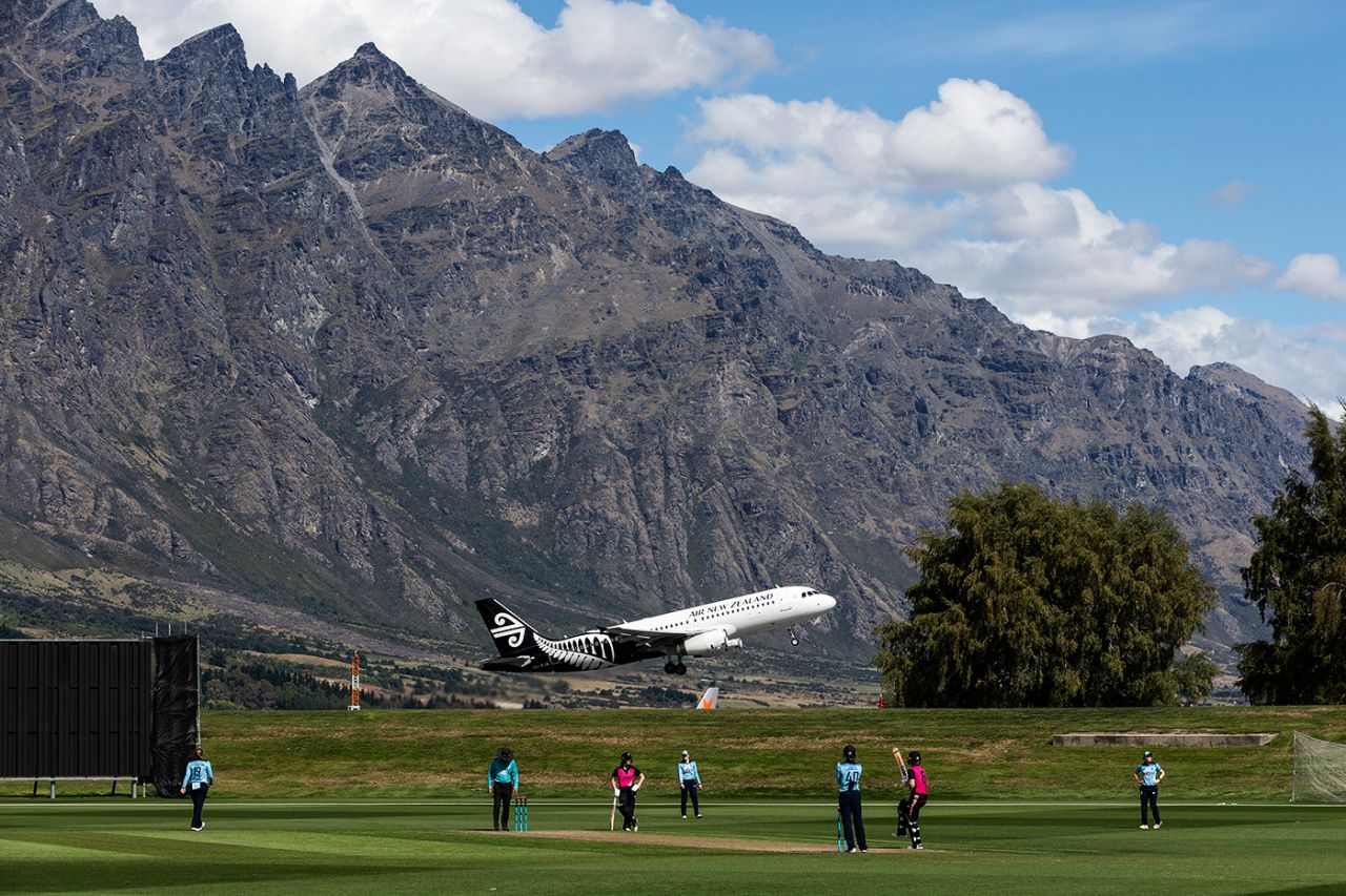 An aeroplane takes off in the backdrop as play gets underway at the John Davies Oval, New Zealand Women XI and England Women, first 50-over warm-up, Queenstown, February 14, 2021