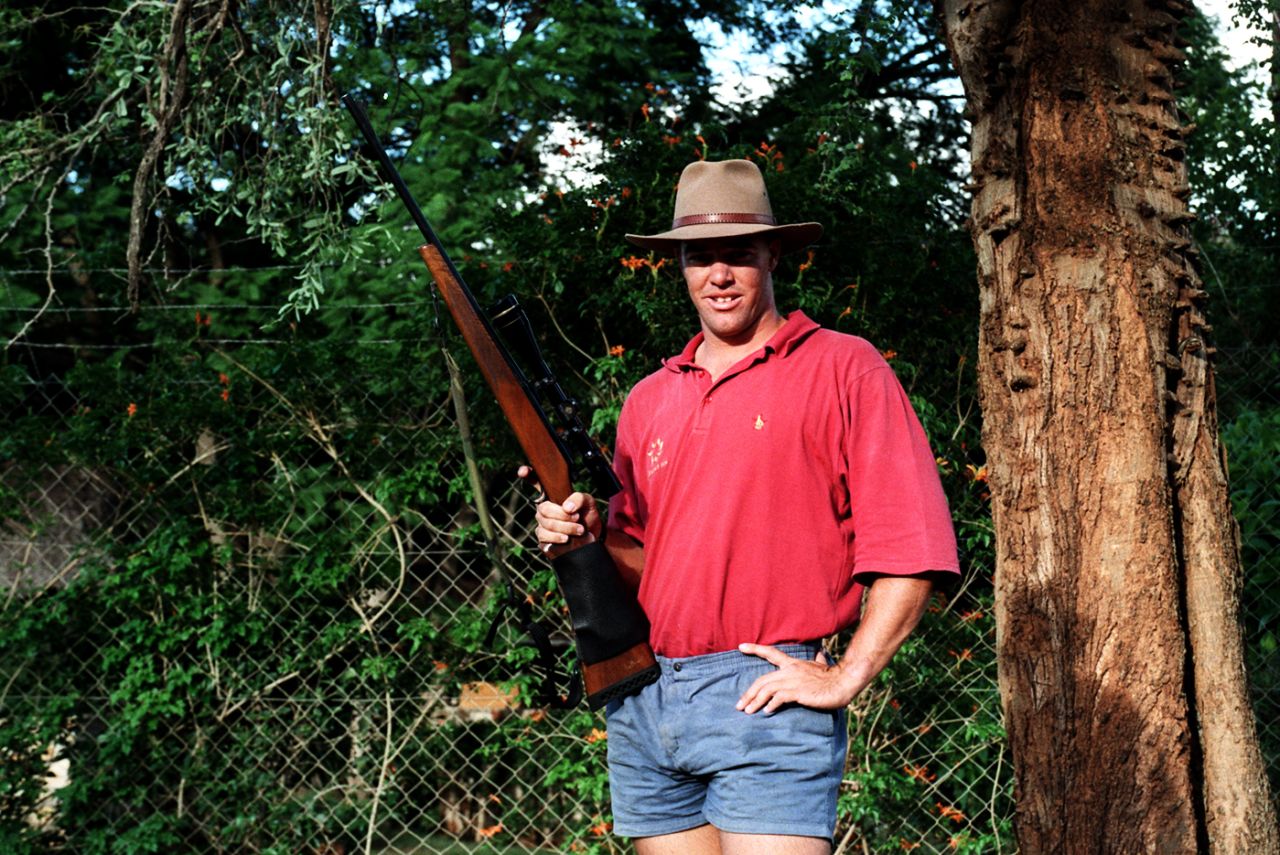 Heath Streak poses with a gun at his farm, Bulawayo, December 2, 1996