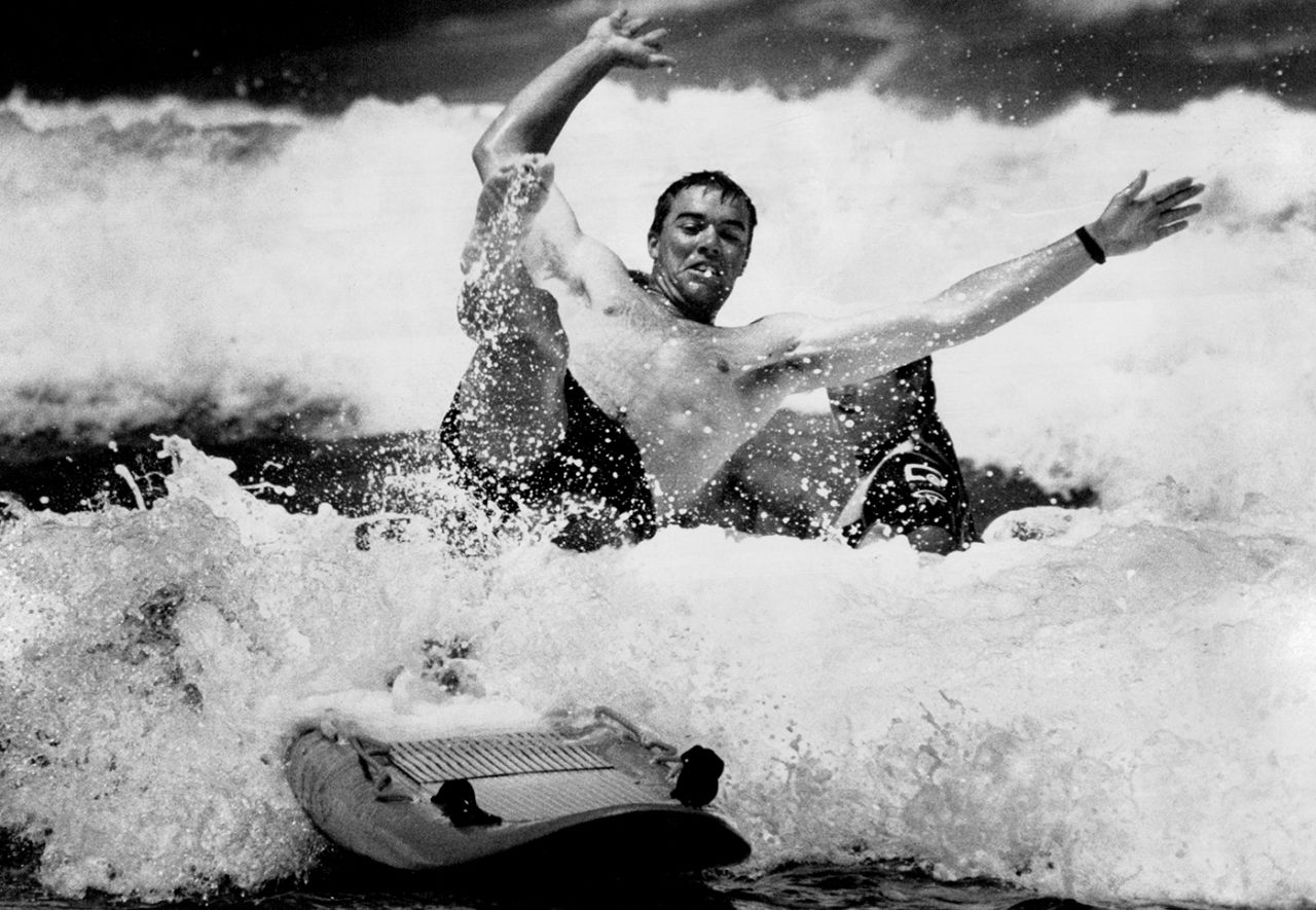 Heath Streak tries his hand at surfing on Manly Beach in Sydney, December 14, 1994